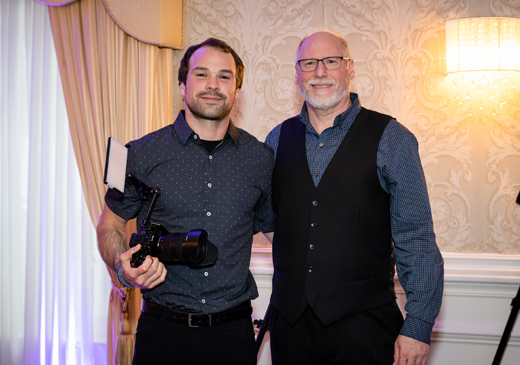 Wedding & Event Videographers, Zach and Tom, posing for the camera at Paris Caterers in Berlin, NJ